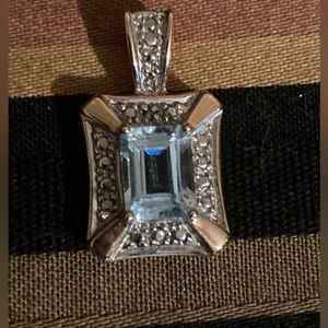 Genuine blue topaz set in sterling silver and gold plating stamped 925
